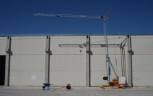 Self-erecting crane for construction